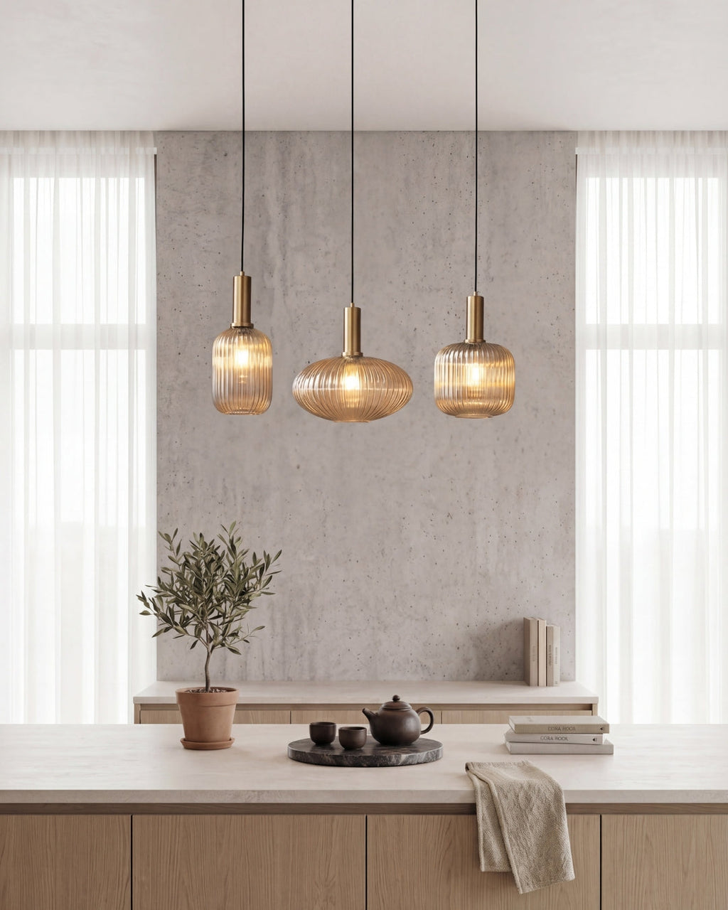Glass pendant light with adjustable black cord and gold fitting