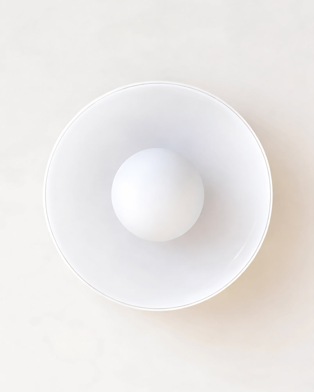 Glass wall light with soft, even warm white glow