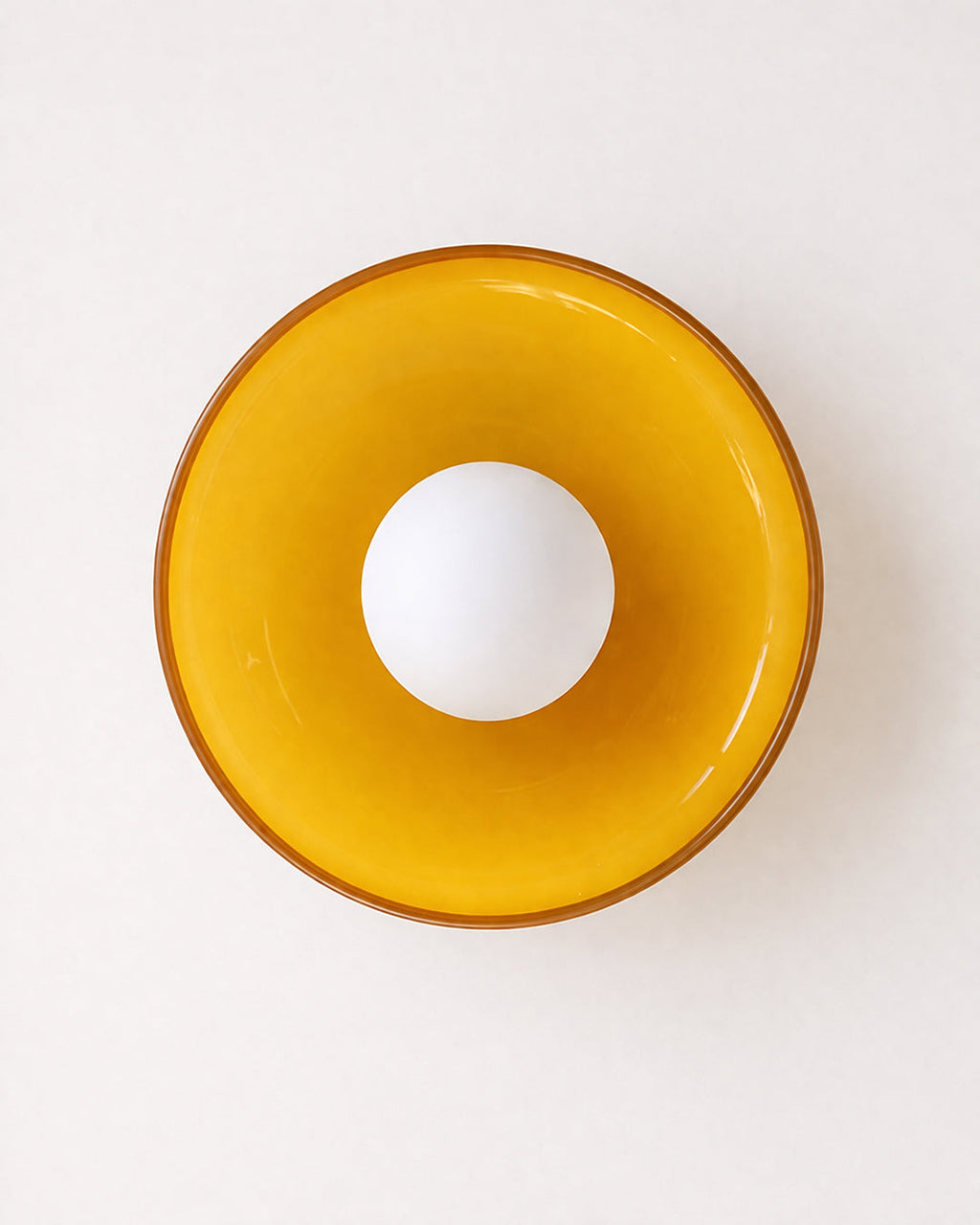Retro glass wall light mounted in a hallway