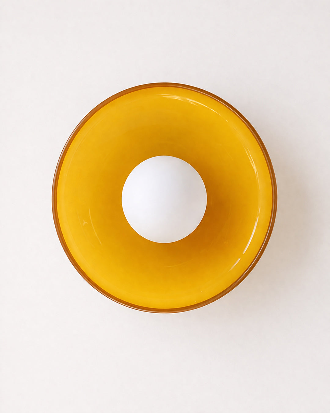 Retro glass wall light mounted in a hallway