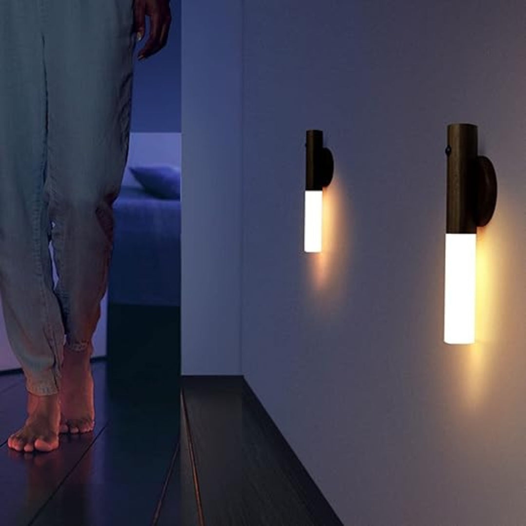 Two LED torch lights lighting a hallway at night