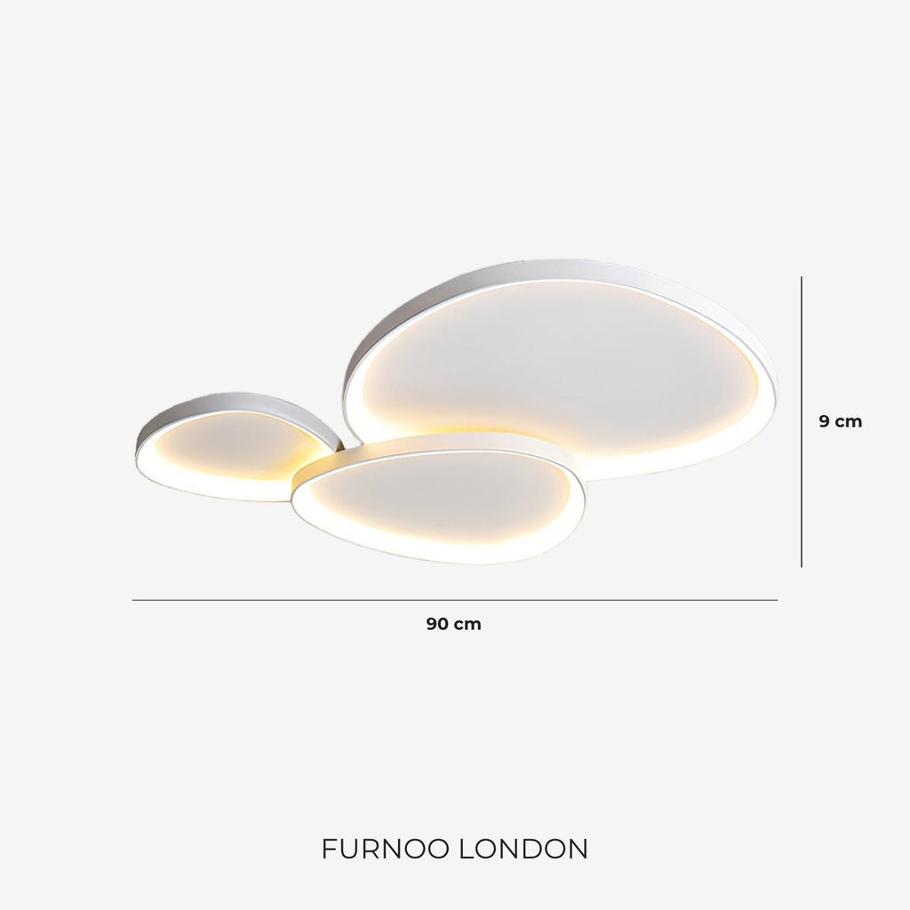 Sculptural LED ceiling fixture lighting a quiet room