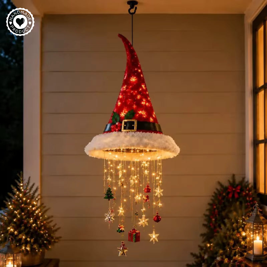 Lighted Santa hat decoration hanging on a covered porch