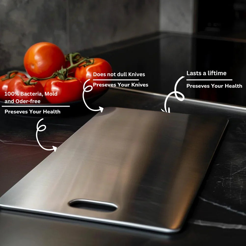 Brushed metal cutting board on a dark kitchen counter