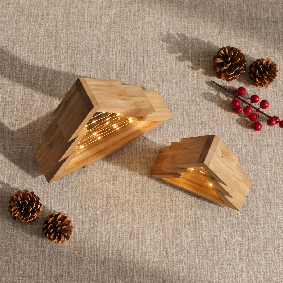 Small Christmas tree set seen from above beside pine cones