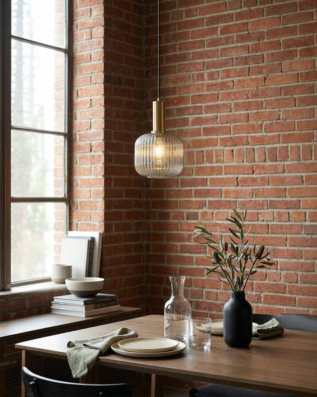 Cognac ribbed glass pendant light casting a warm amber glow