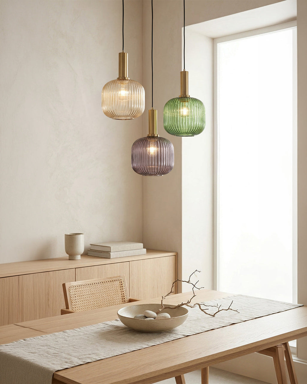 Glass pendant lights as dining room lights over table