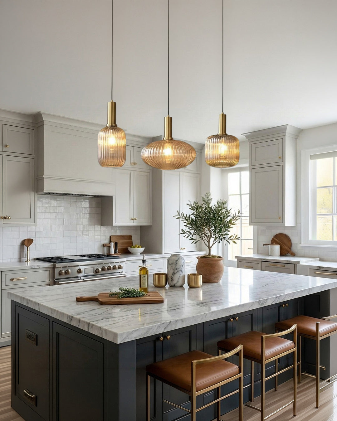 Trio of glass pendant lights hung at different heights