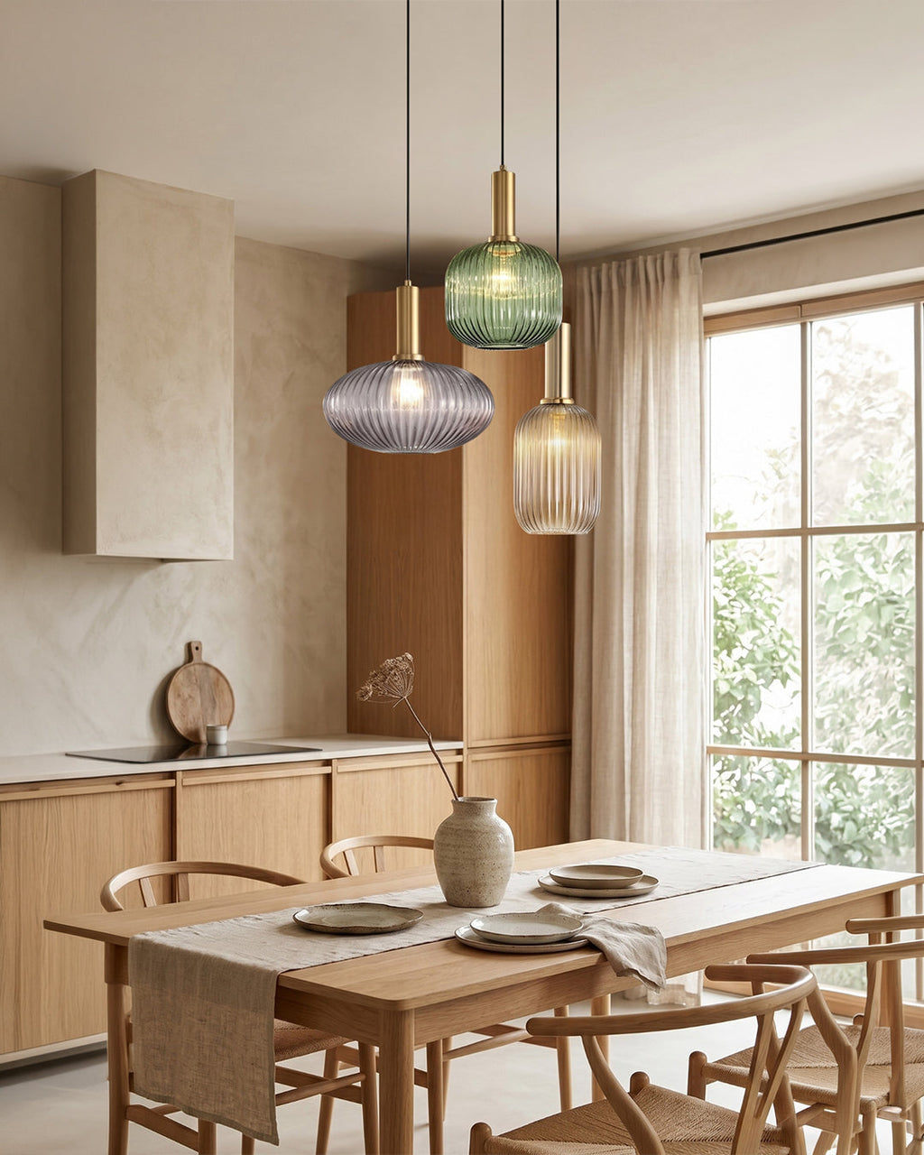 Cluster of island pendant lights in ribbed colored glass