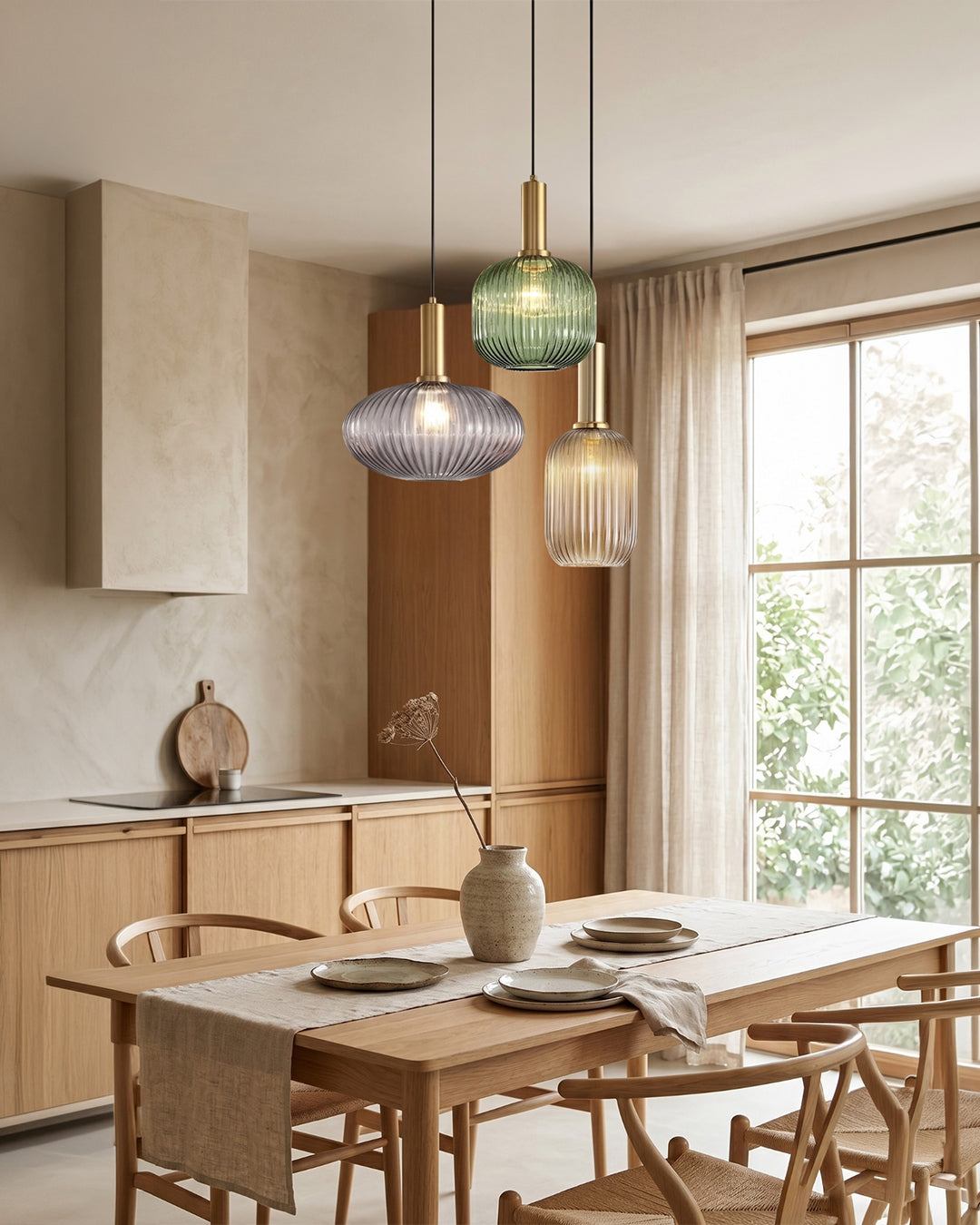 Cluster of island pendant lights in ribbed colored glass