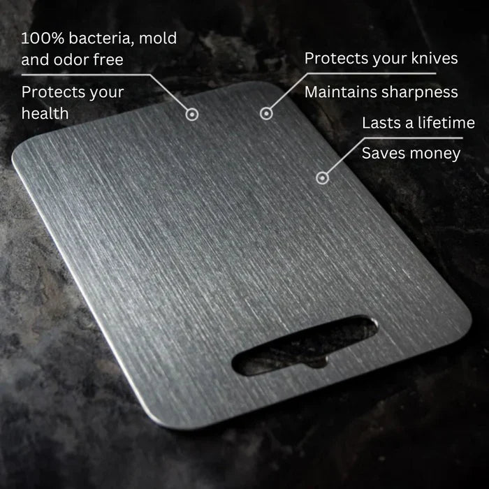 Stainless steel cutting board with cutout handle on dark stone