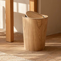 Natural wood-look bin under a wooden table beside a jute rug