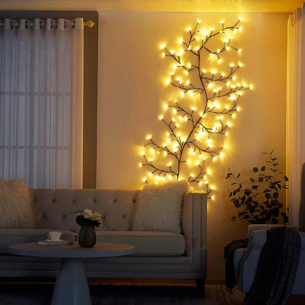 Willow style wall lamp glowing on a bedroom wall