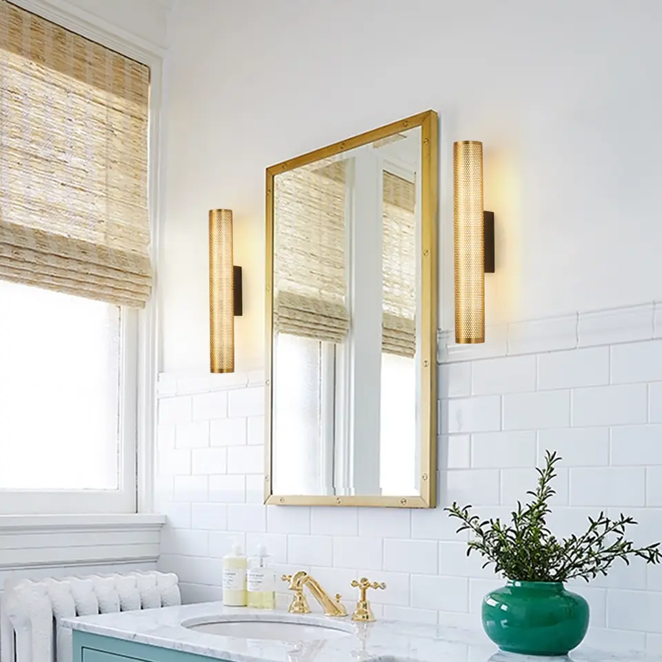Gold vanity sconce lit