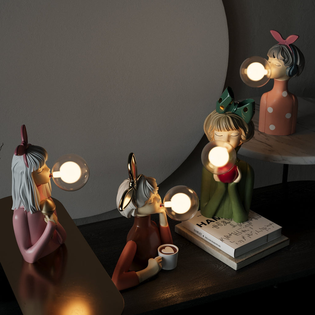 Sculptural lamp on a stack of books with glowing glass bubble