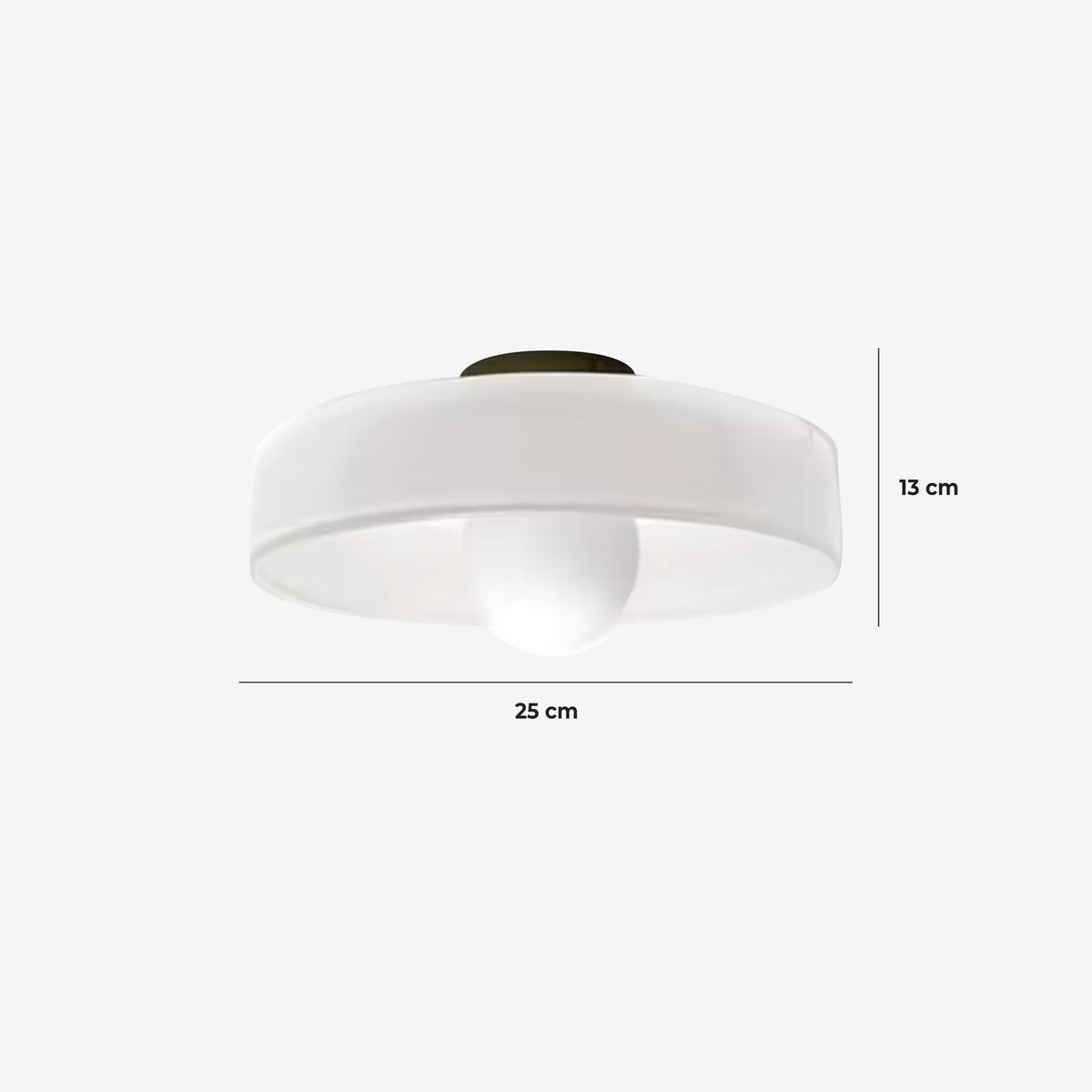 Circular glass wall light in a bedroom setting