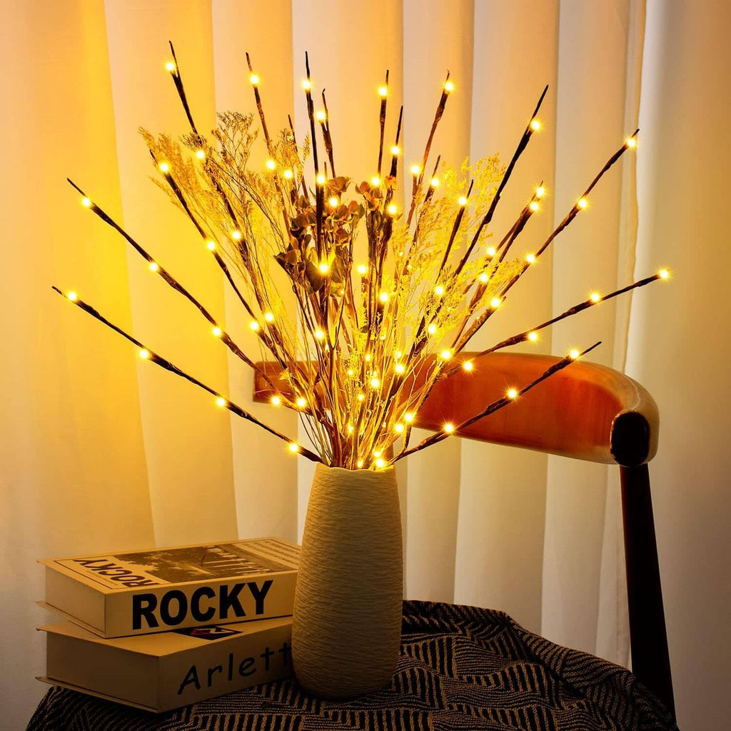 LED branches mixed with dried flowers in a textured vase