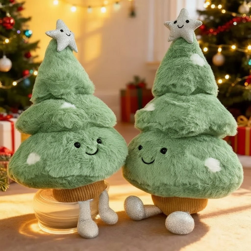 Two plush miniature christmas tree figures beside a decorated tree