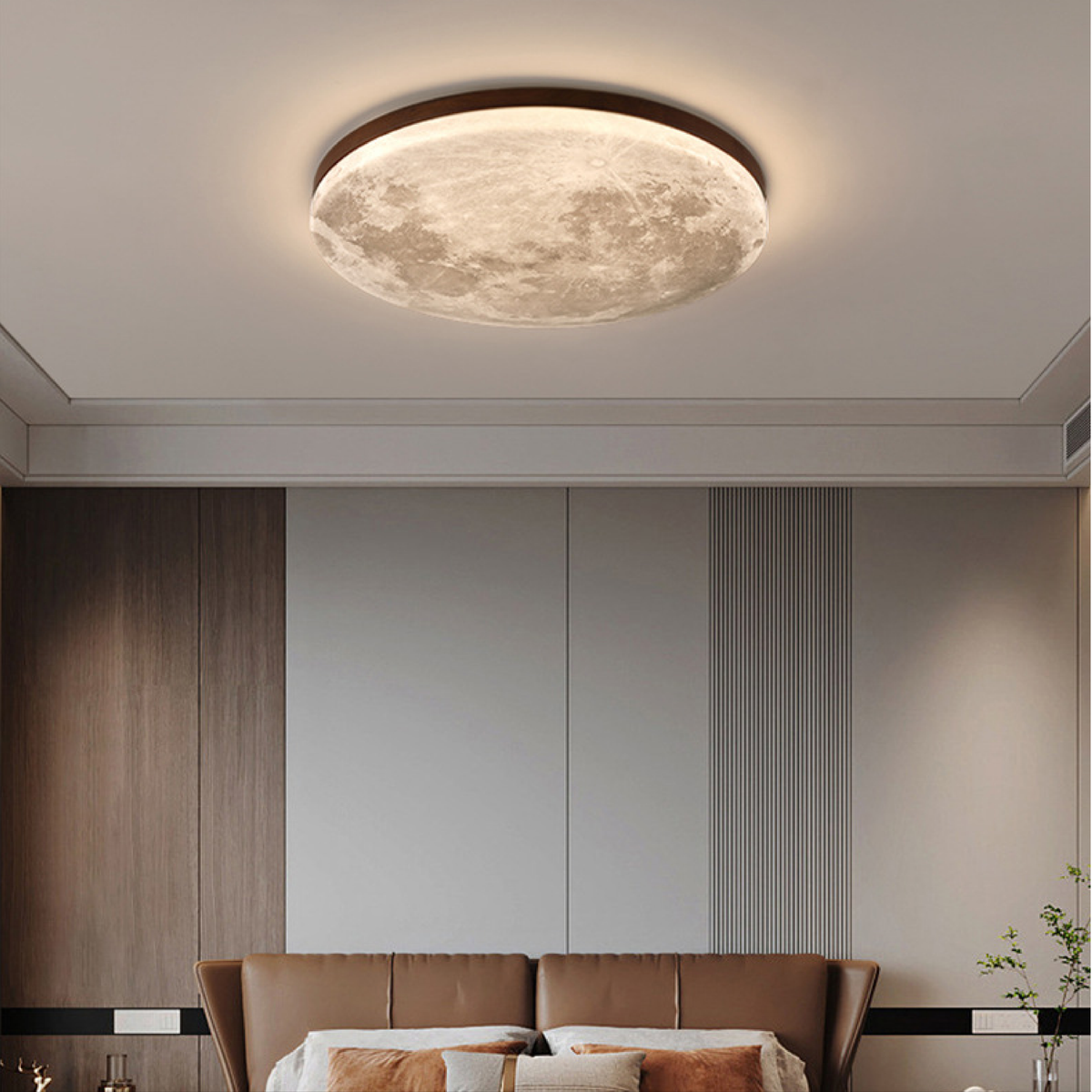 Moon ceiling light with dark wood rim above a leather bed