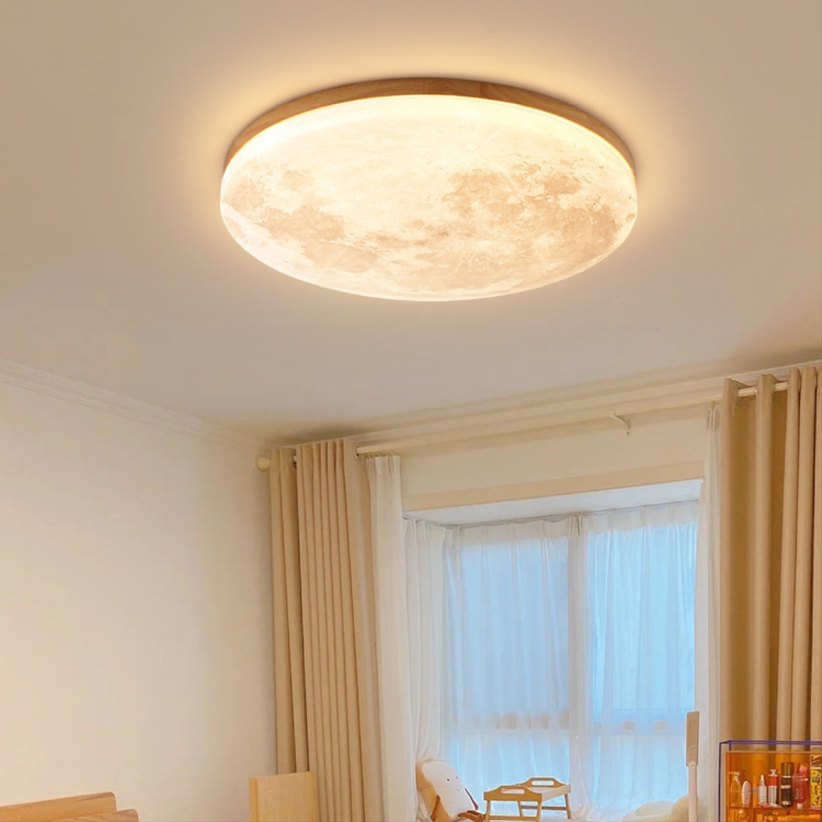 Flush mount ceiling light shaped like a moon in a cozy bedroom