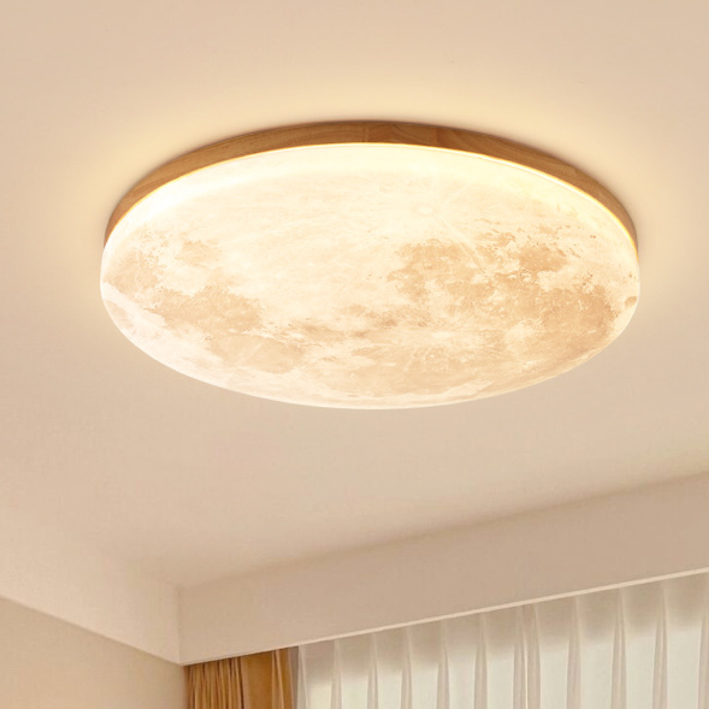 Moon LED ceiling light with light wood rim glowing warm white