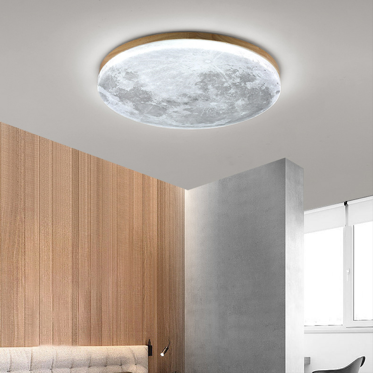Light wood moon LED ceiling light in cool white over wood paneling