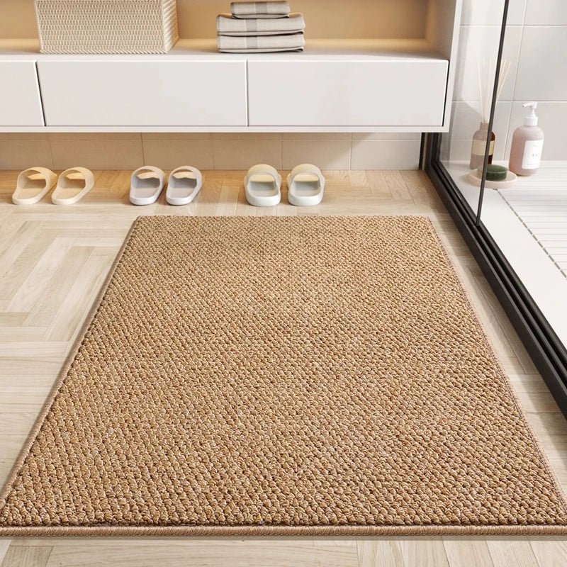 Coffee brown absorbent doormat on light wood floor