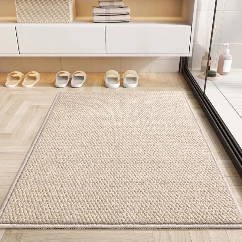 Beige textured doormat in front of bathroom shelves and slippers