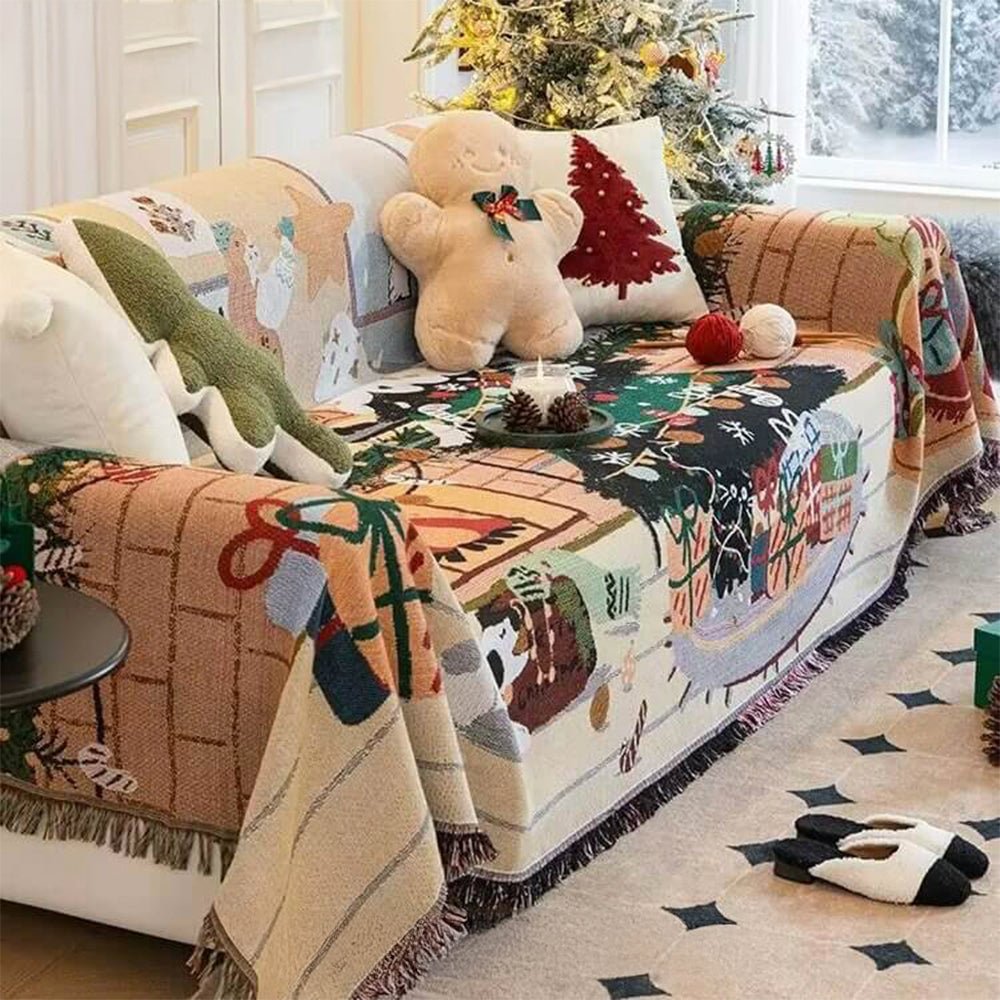 Fireside scene Christmas couch throw draped over a cream sofa