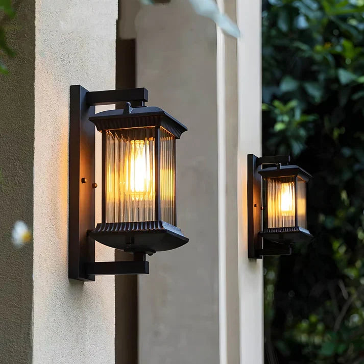 Pair of exterior wall lights flanking a garden entryway