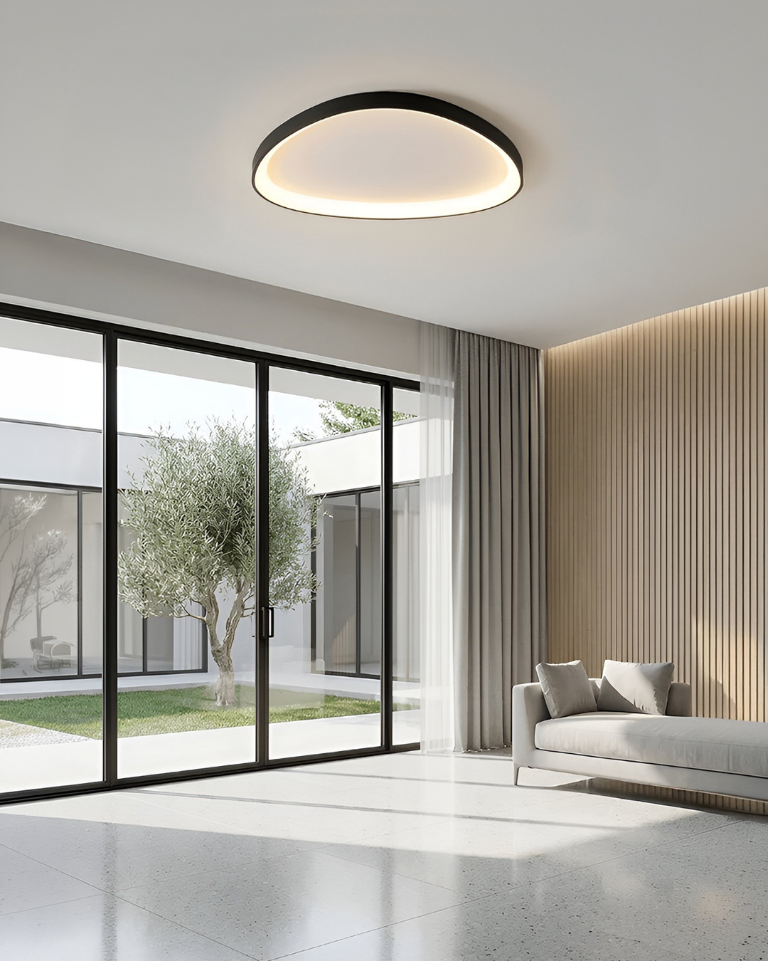 Black ceiling light for living room beside tall glass doors