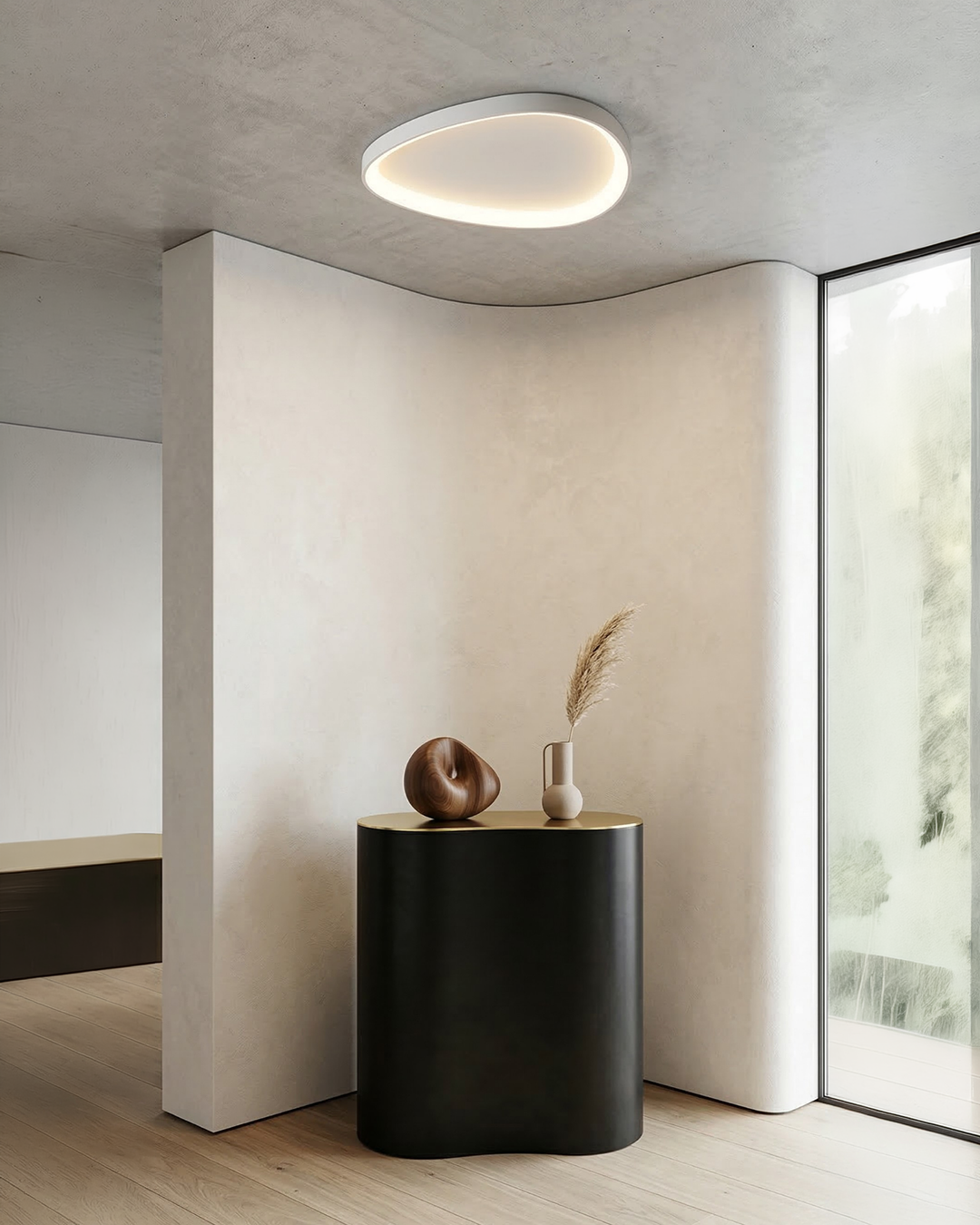 White single sculptural ceiling fixture on a clean ceiling