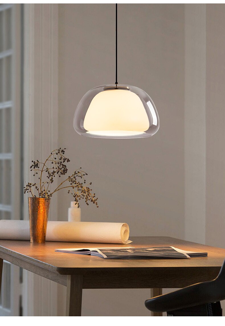 Glass globe pendant over kitchen island