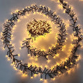 Warm white cluster string Christmas lights coiled in a glowing spiral