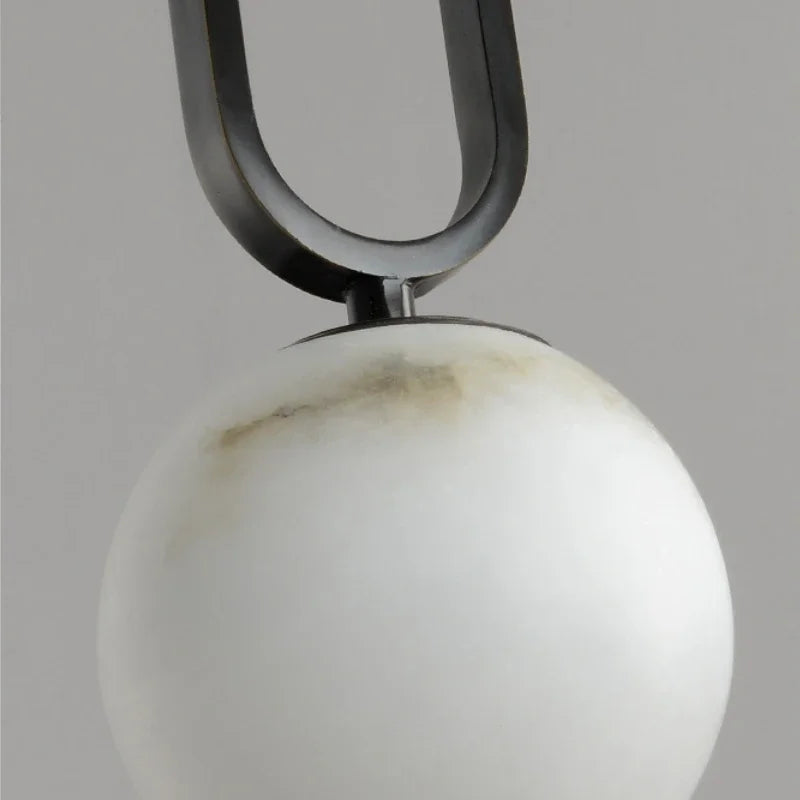 Marble pendant light over kitchen island