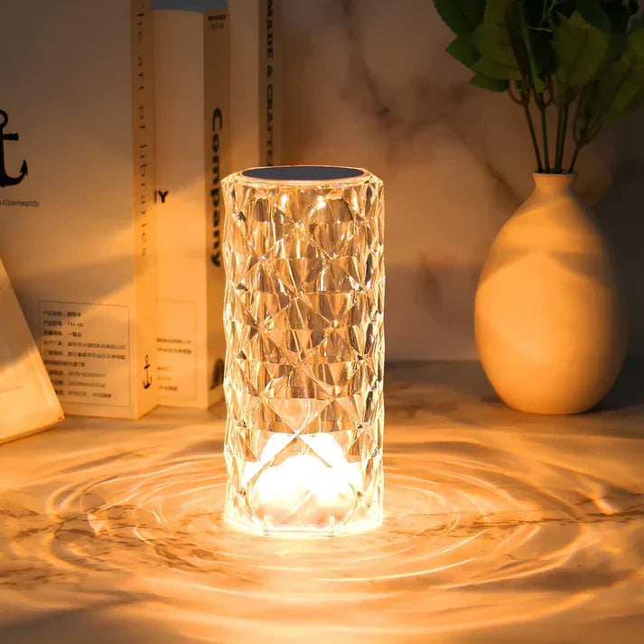 Cordless table lamp casting light ripples on a marble surface