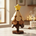 Wooden Christmas tree trivet with star topper on marble table