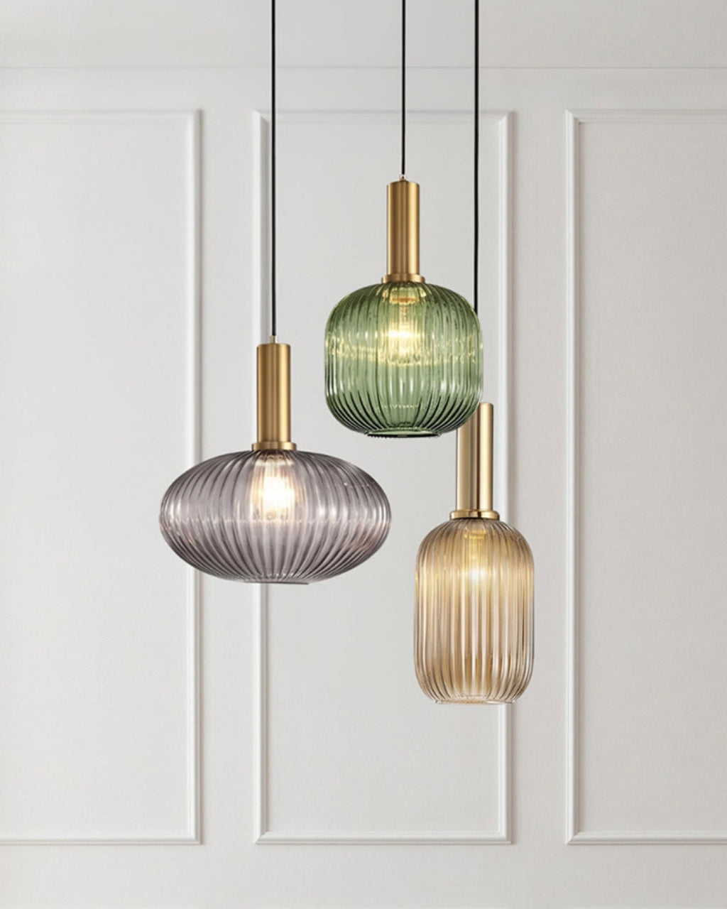 Three ribbed glass pendant lights in gray, green and cognac