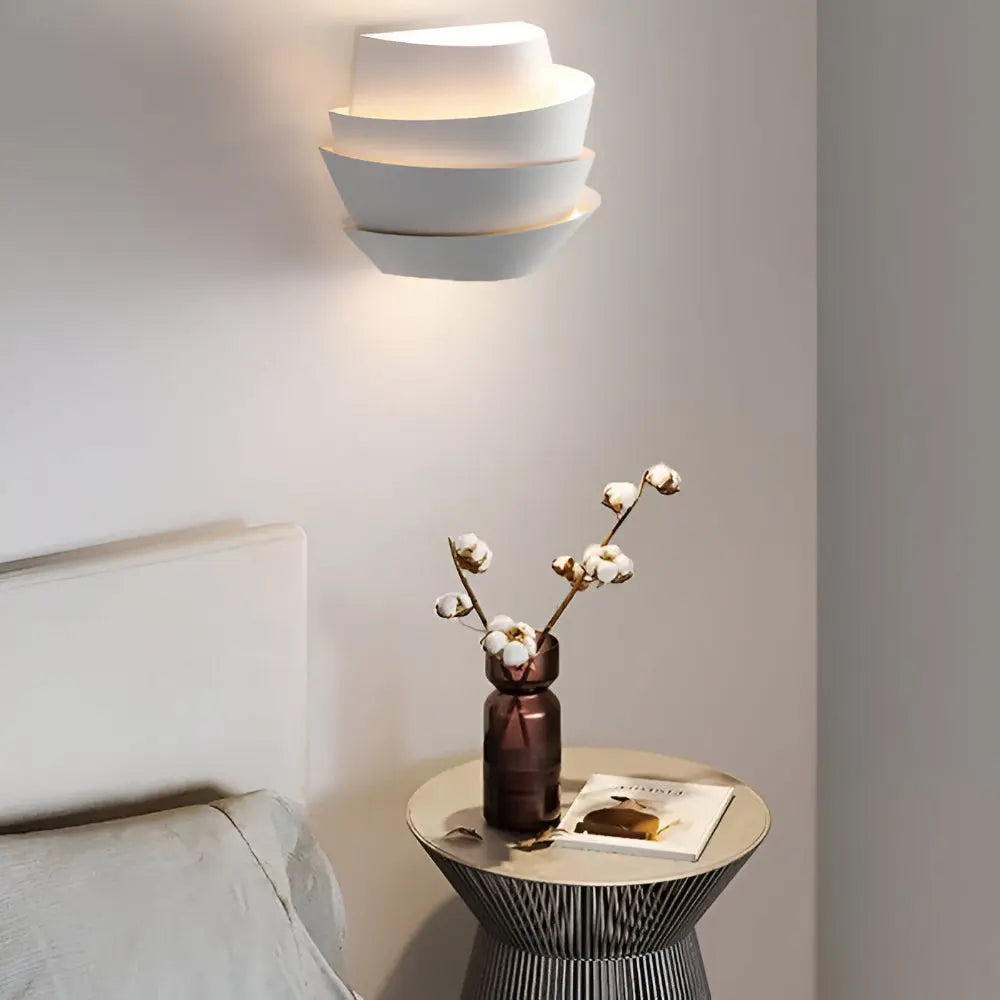 Wall lights for bedroom above a nightstand with cotton stems