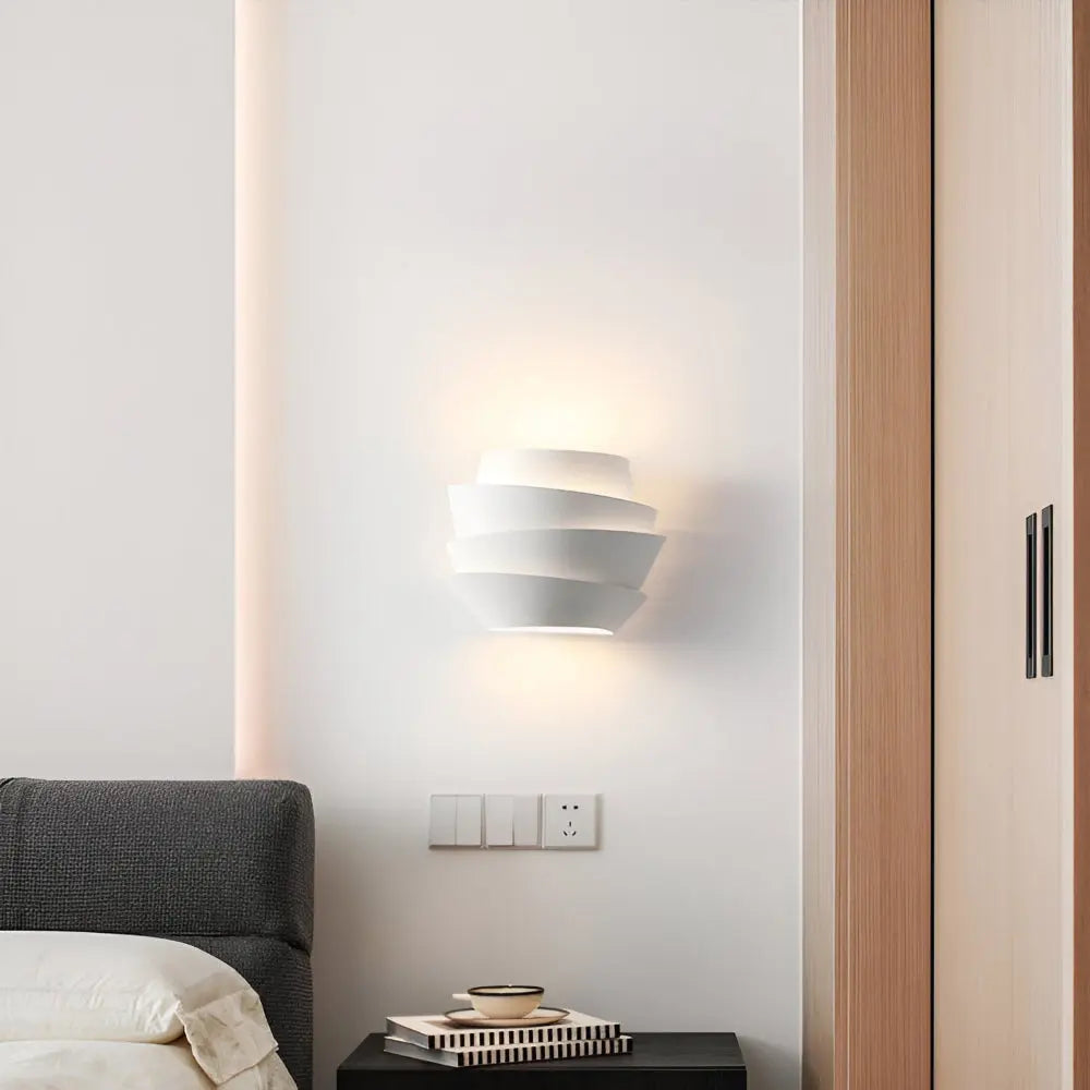 White iron wall sconce as warm living room lighting