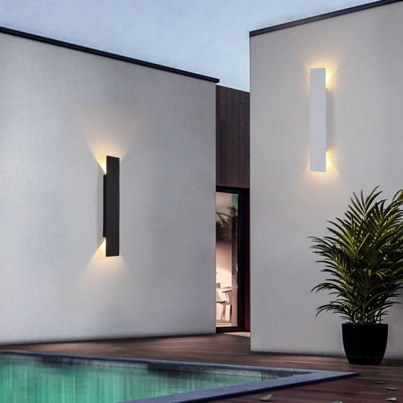 Black and white LED wall lights on smooth white walls