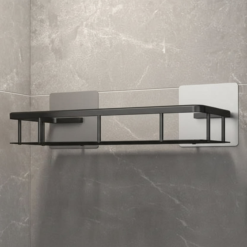 Matte black adhesive bathroom shelf mounted on gray marble tile