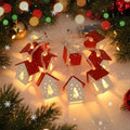 Battery operated Christmas lights with glowing red and cream paper houses