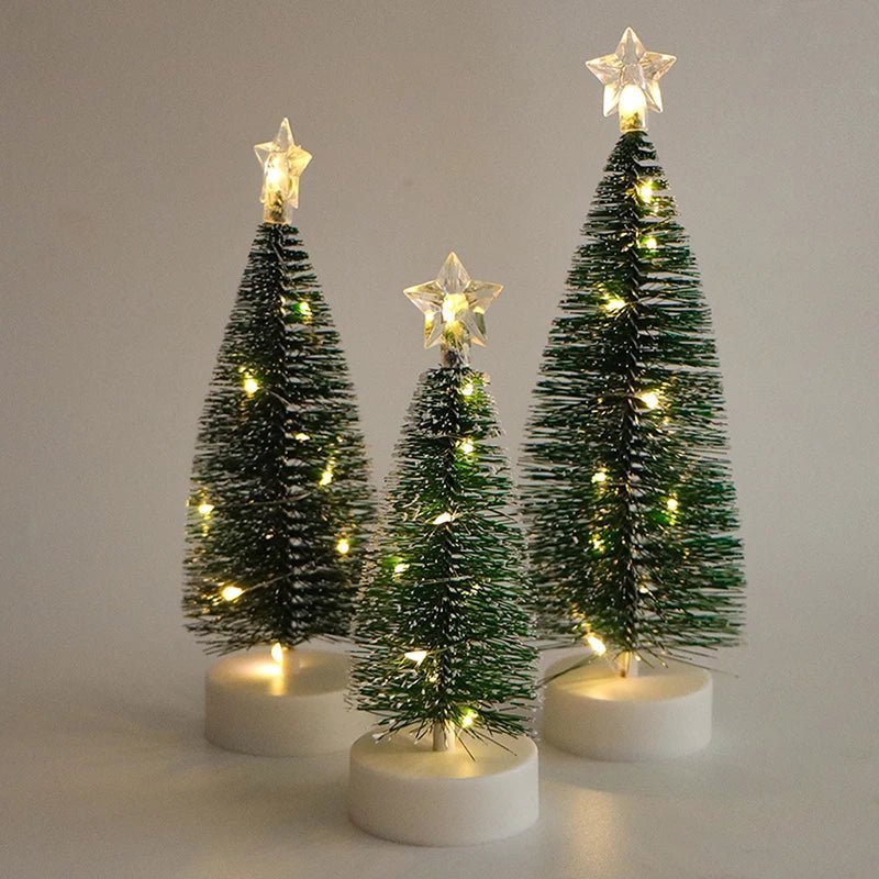 Three LED Christmas trees in different heights on white bases
