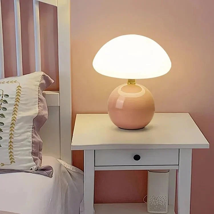 Compact lamp with soft diffused glow on a side table