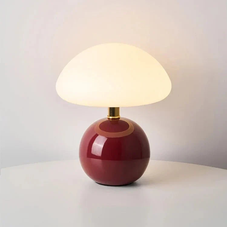 Glossy ceramic base and gold-tone neck detail close-up