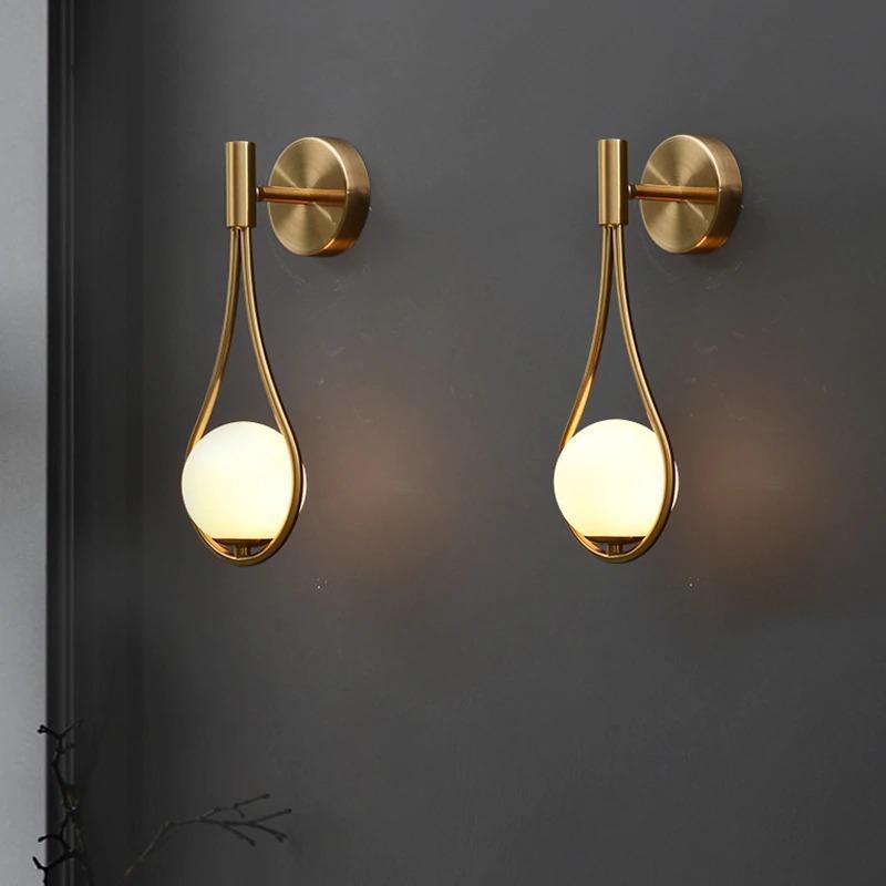 Minimalist wall sconce beside bed
