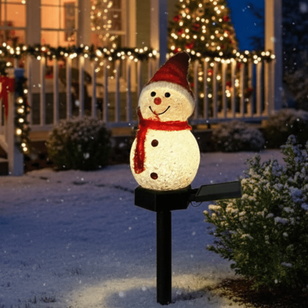 Snowman pathway Christmas lights in a snowy front yard
