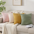 Plush ribbed 18x18 pillow covers on a cream sofa with knit throw