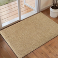 Woven indoor door mat in front of a sliding glass door